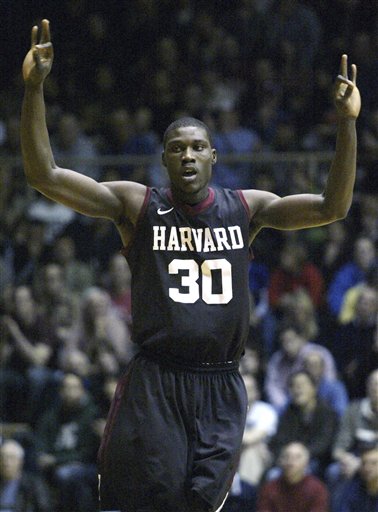 In Feb. 10, 2012, file photo, Harvard's Kyle Casey (30) celebrates after he scored against Penn in the first half of an NCAA college basketball game in Philadelphia. Casey plans to withdraw from school amid a cheating scandal that also may involve other athletes, according to several reports. Sports Illustrated and the Harvard Crimson reported Tuesday that Casey, a senior, would withdraw in an attempt to preserve a year of eligibility once the issue is resolved. (AP Photo/H. Rumph Jr, File)
