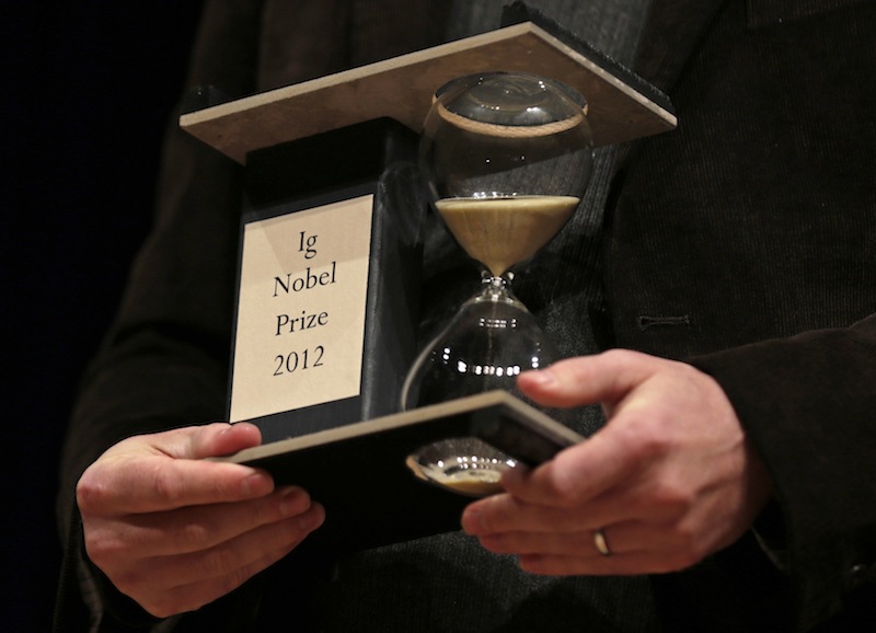 A 2012 Ig Nobel Prize trophy is held during a performance at the Ig Nobel Prize ceremony at Harvard University, in Cambridge, Mass., Thursday, Sept. 20, 2012. The Ig Nobel prize is an award handed out by the Annals of Improbable Research magazine for silly sounding scientific discoveries that often have surprisingly practical applications. (AP Photo/Charles Krupa)