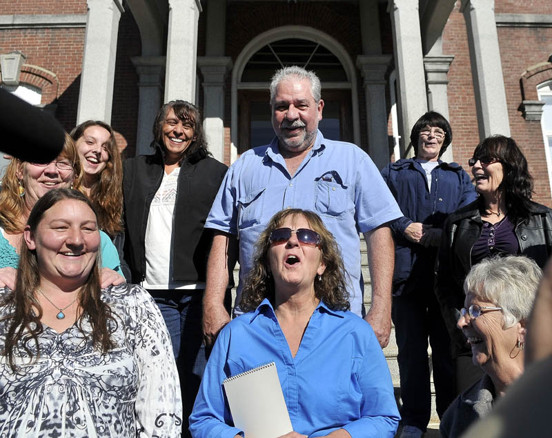 Christine Belangia, of Weld, celebrates with friends and family on the steps of Somerset County Superior Court after Jay Mercier was found guilty for the murder of her sister Rita St. Peter.