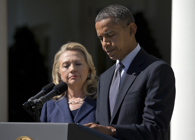 President Barack Obama, accompanied by Secretary of State Hillary Rodham Clinton, speaks about the death of U.S. ambassador to Libya Christopher Stevens, Wednesday, Sept. 12, 2012, in the Rose Garden of the White House in Washington. (AP Photo/Evan Vucci)