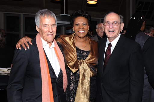 Legendary songwriters Bert Bacharach, left, and Hal David join singer Dionne Warwick on Oct. 17, 2011, at the "Love, Sweet Love" musical tribute to David in Los Angeles. David, who, along with Bacharach, penned dozens of top 40 hits for a variety of recording artists in the 1960s and beyond, died Saturday in Los Angeles.