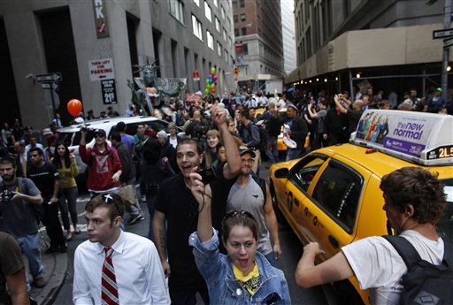 Occupy protesters fill an intersection on Monday in New York. A handful of other Occupy protesters was arrested during a march on the New York Stock Exchange on the anniversary of the grass-roots movement.