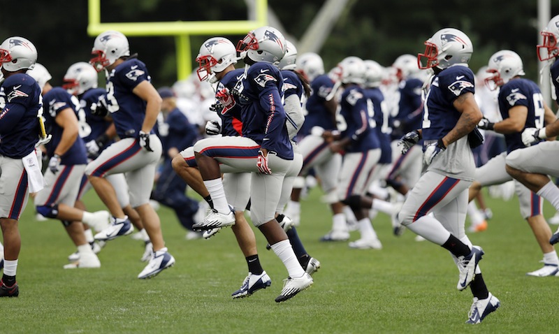 New England Patriots players high-step during practice at Gillette Stadium in Foxborough, Mass. Wednesday, Sept. 5, 2012. The Patriots are preparing for their NFL football season opener against the Tennessee Titans on Sunday. (AP Photo/Elise Amendola)