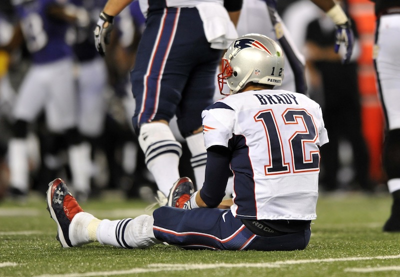 New England Patriots quarterback Tom Brady looks on after not being able to convert for a first down in the second half of an NFL football game against the Baltimore Ravens in Baltimore, Sunday, Sept. 23, 2012. Baltimore won 31-30. (AP Photo/Gail Burton) NFLACTION12;