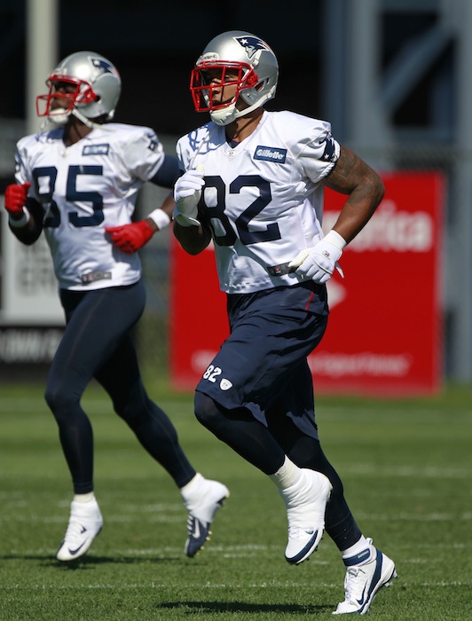 New England Patriots wide receiver Brandon Lloyd, left, and tight end Kellen Winslow (82) run on the field during a team practice at Gillette Stadium, in Foxborough, Mass., Wednesday, Sept. 19, 2012. The Patriots announced Wednesday that they signed Winslow. (AP Photo/Steven Senne)