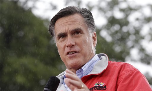 In this Sept. 14, 2012, photo, Republican presidential candidate, former Massachusetts Gov. Mitt Romney campaigns in the rain at Lake Erie College in Painesville, Ohio. (AP Photo/Charles Dharapak)