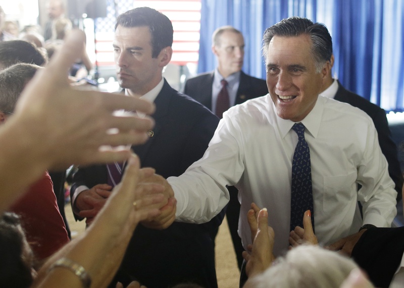 Republican presidential candidate Mitt Romney greets supporters at his campaign headquarters in Jacksonville, Fla., Wednesday, Sept. 12, 2012.
