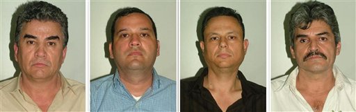 This photo released by the Spanish Interior Ministry shows suspected members of a Mexican drug cartel, from left: Jesus Gutierrez Guzman, Samuel Zazueta, Rafael Humberto Celaya Valenzuela, and Jesus Gonzalo Palazuelos Soto. Spanish police working in a joint investigation with the FBI's Boston Division have halted an attempt by a major Mexican drug smuggling ring to establish a European operation. Investigators intercepted a container carrying 822 pounds of cocaine in July, leading to the arrests.