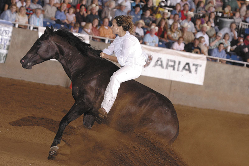 Stacy Westfall, who was raised in Palermo and South China, is seen during a bareback bridleless ride with Whizards Baby Doll — aka Roxy — seen by millions on Internet during a 2006 championship ride at the All American Quarter Horse Freestyle Competition.