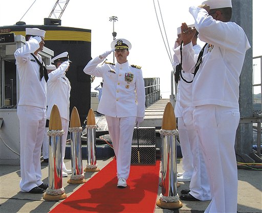 In this Aug. 3, 2012 photo provided by the U.S. Navy, Cmdr. Michael P. Ward II, center, is saluted during the change-of-command ceremony for the nuclear submarine USS Pittsburgh at the Naval Submarine Base New London, in Groton, Conn.