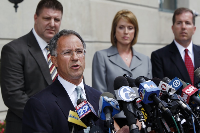 U.S. Attorney Paul Fishman, second left, stands with other law enforcement officials outside the Federal courthouse Monday, Sept. 10, 2012, in Trenton, N.J., as he announces that Federal agents arrested Trenton Mayor Tony Mack, the mayor of New Jersey's capital city, earlier Monday as part of an ongoing corruption investigation into bribery allegations related to a parking garage project that was concocted as part of an FBI sting operation. Mack, his brother, Ralphiel, and convicted sex offender Joseph Giorgianni, a Mack supporter who owns a Trenton sandwich shop, were accused of conspiring to obstruct, delay and affect interstate commerce by extortion under color of official right. (AP Photo/Mel Evans)