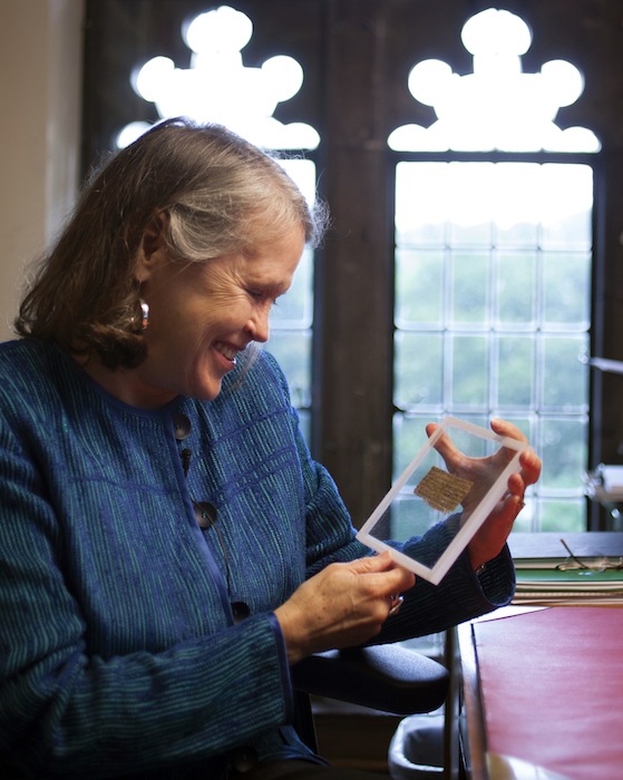 Divinity professor Karen L. King holds a 4th-century fragment of papyrus that she says quotes Jesus explicitly referring to having a wife. King, an expert in the history of Christianity, says the text contains a dialogue in which Jesus refers to "my wife," whom he identified as Mary.