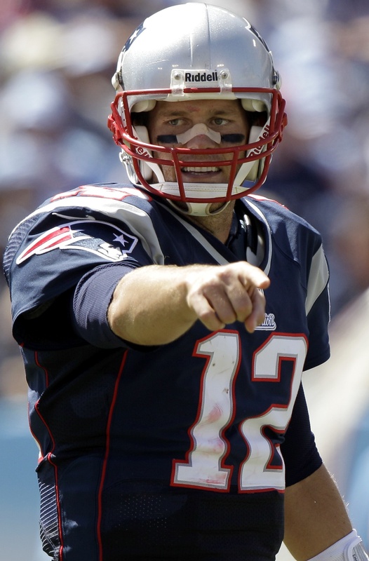 Tom Brady sported a bandage on his nose after a sack in the second quarter against Tennessee, but he guided the Patriots to their ninth straight season-opening win. LP Field