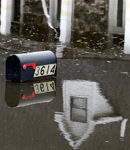 A mailbox peeks above floodwaters from Hurricane Isaac in Braithwaite, La., Sunday, Sept. 2, 2012. More than 200,000 people across Louisiana still didn't have any power five days after Hurricane Isaac ravaged the state. Thousands of evacuees remained at shelters or bunked with friends or relatives. (AP Photo/Gerald Herbert)