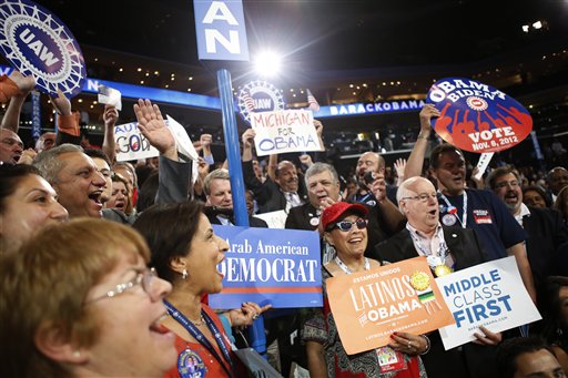 Michigan delegates react as President Barack Obama is nominated for the Office of the President of the United States at the Democratic National Convention in Charlotte, N.C., on Thursday, Sept. 6, 2012. (AP Photo/Jae C. Hong)