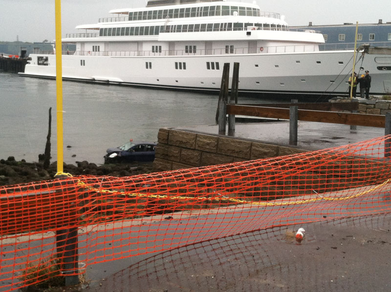 Site of a crash that left a car in the harbor today in Portland at the base of India Street.