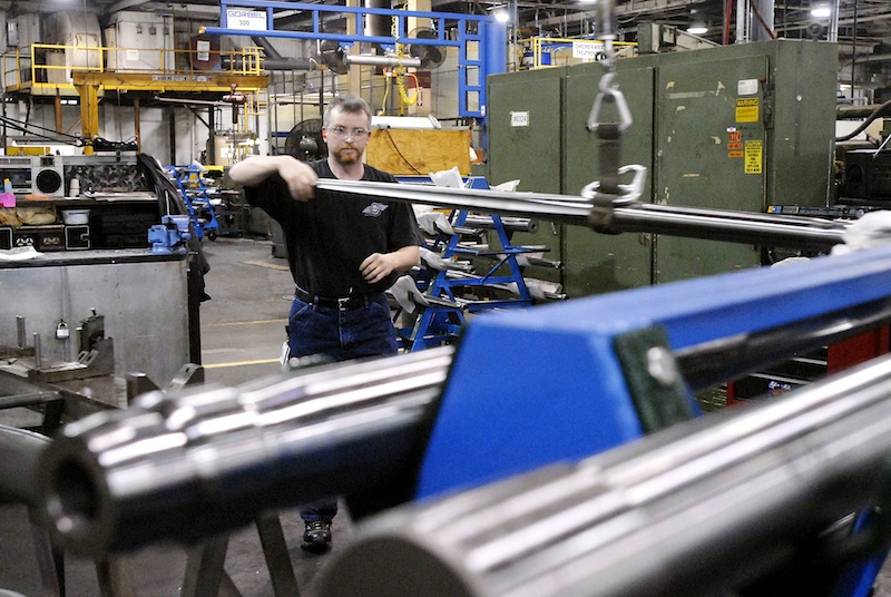 In this January 2007 file photo, David McKnight moves a machine gun barrel to a polishing machine at the General Dynamics Armament and Technical Products Operation in Saco which manufactures machine guns and other weapons systems for the military. General Dynamics announced Tuesday, Sept. 25 it was laying off 30 from the Maine plant.