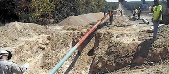 A still image from a video posted Tuesday on the website of Summit Natural Gas shows work crews placing and welding a 6-inch high-pressure steel pipeline in Lake of the Ozarks region, Missouri, which will serve 10 towns and about 4,000 customers. An appeals panel has found the state erred when solicited bids for a natural gas pipeline project in central Maine, awarding the bid to Central Maine Power Co.-affiliated Maine Natural Gas over Summit Natural Gas.