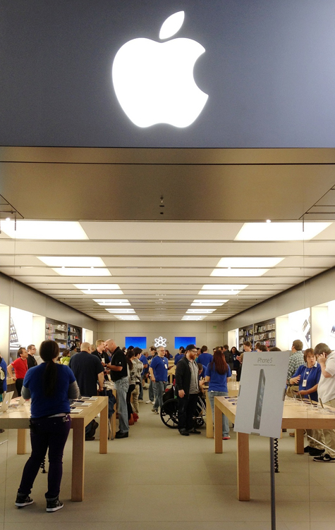 Customers fill the Apple Store at The Maine Mall in South Portland on Friday morning to buy the iPhone 5. Over 100 people waited in line for hours for a chance to buy the phone on the first day it was available.