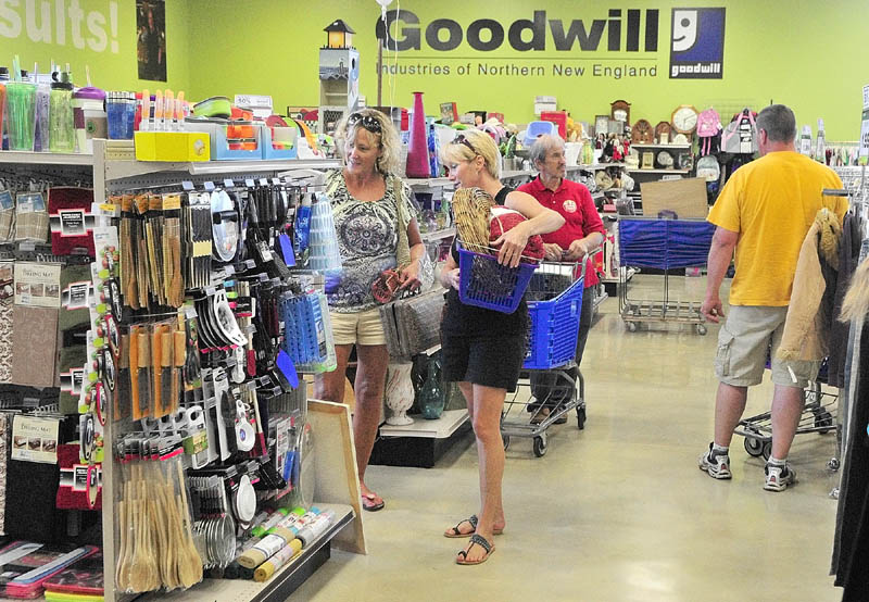 Shoppers browse in the new location of the Goodwill store that opened at 5 Senator Way on Thursday in Augusta. The new store has 10,000 square feet of retail space plus 7,000 square feet of backroom space to process donations, according to store manager Isis Truman.
