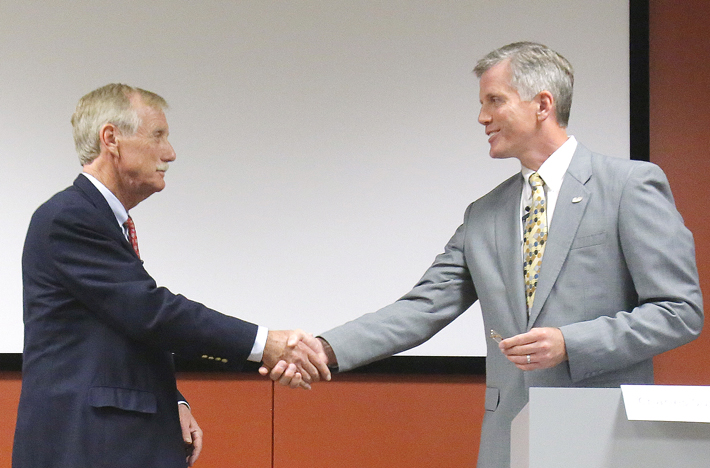 U.S. Senate candidates Angus King, left, and Charlie Summers shake hands at the end of their debate at Texas Instruments in South Portland on Wednesday.