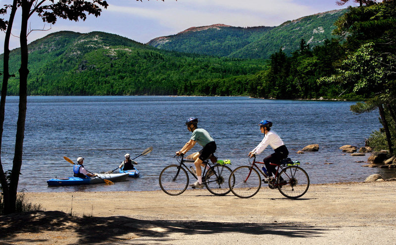 Visitors enjoy Eagle Lake at Acadia National Park, which saw a 17.6 percent jump in visits in May and a nearly 4 percent jump in June compared with a year earlier, then a dip in July.