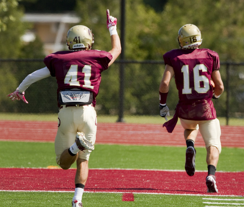 Josh Cyr of Thornton Academy shows his enthusiasm as teammate Andrew Libby reaches the end zone on a punt return.