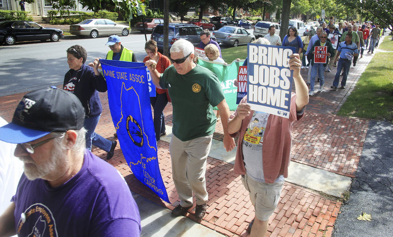 Attendees at the Southern Maine Labor Council’s annual breakfast conclude the event, held Monday at the Maine Irish Heritage Center, with a march along State Street to Longfellow Square for a poetry reading. As they marched, they chanted, “We are the 99 percent.”