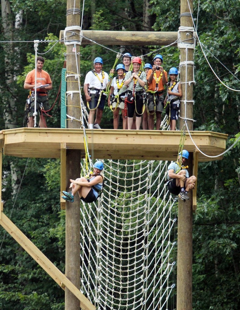 Zip lines at Mount Sunapee ski area in Newbury, N.H. attract summer visitors. Ski areas throughout New England have added year-round recreational features, including water parks and ice hockey arenas.