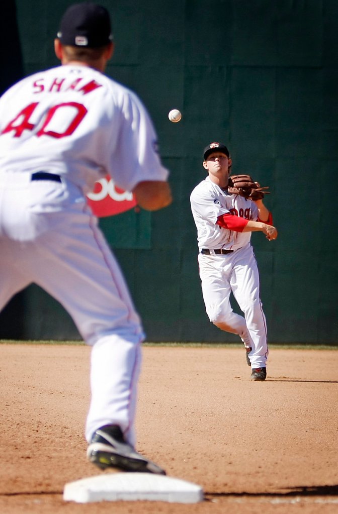 Zach Gentile, Sea Dogs second baseman, throws to Travis Shaw for an out in the top of the seventh inning Monday at Hadlock Field.