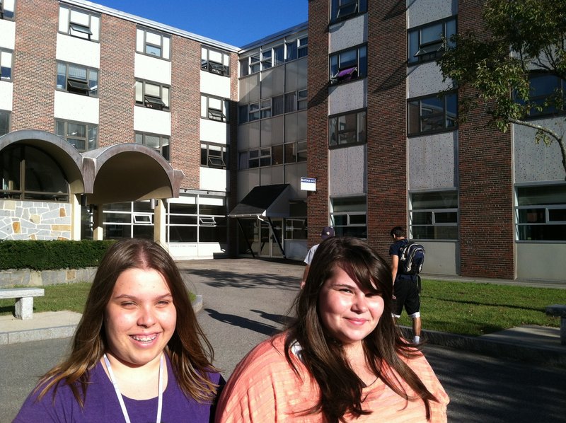 Marnie Lantagne, left, of Arundel, and Danielle Dalton, of Saco, stand near their dormitory, Upton-Hastings Hall, at USM in Gorham, which was evacuated during a fire Monday.