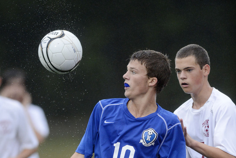 Robby Burns of Kennebunk, left, has the inside position on Sam Tobin of Thornton Academy in an attempt to control the ball Tuesday. Kennebunk won, 2-0.