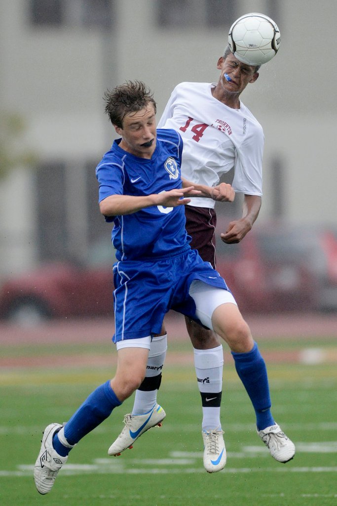 Ryan Keefe of Kennebunk, foreground, and Darius Nytacyo of Thornton Academy attempt to head the ball Tuesday during Kennebunk’s 2-0 victory at Saco.