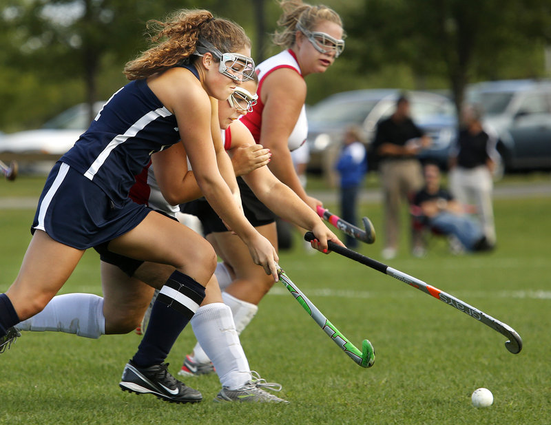 Leanne Reichert of Portland, foreground, and Kailey Hannigan of South Portland contend for the field hockey ball Wednesday during their Southern Maine Activities Association game. South Portland, playing at home, came away with a 2-0 victory.