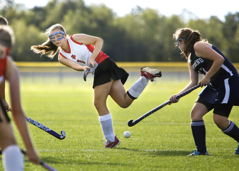 Jaclyn Salevsky of South Portland crosses the ball to a teammate as Tara O’Neal of Portland defends. South Portland improved to 1-1 and dropped Portland to 0-3.