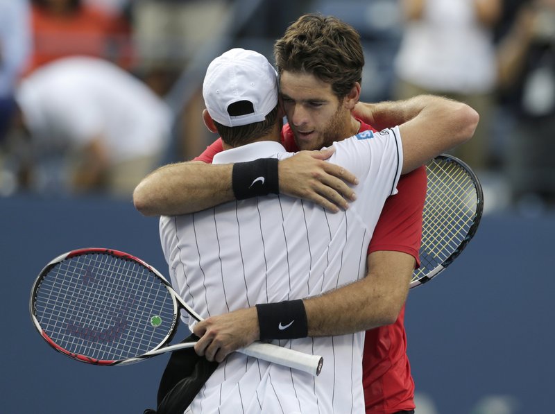 Juan Martin del Potro hugs Andy Roddick after beating him in the fourth round of the U.S. Open on Wednesday. Roddick has said he will retire after the tournament.