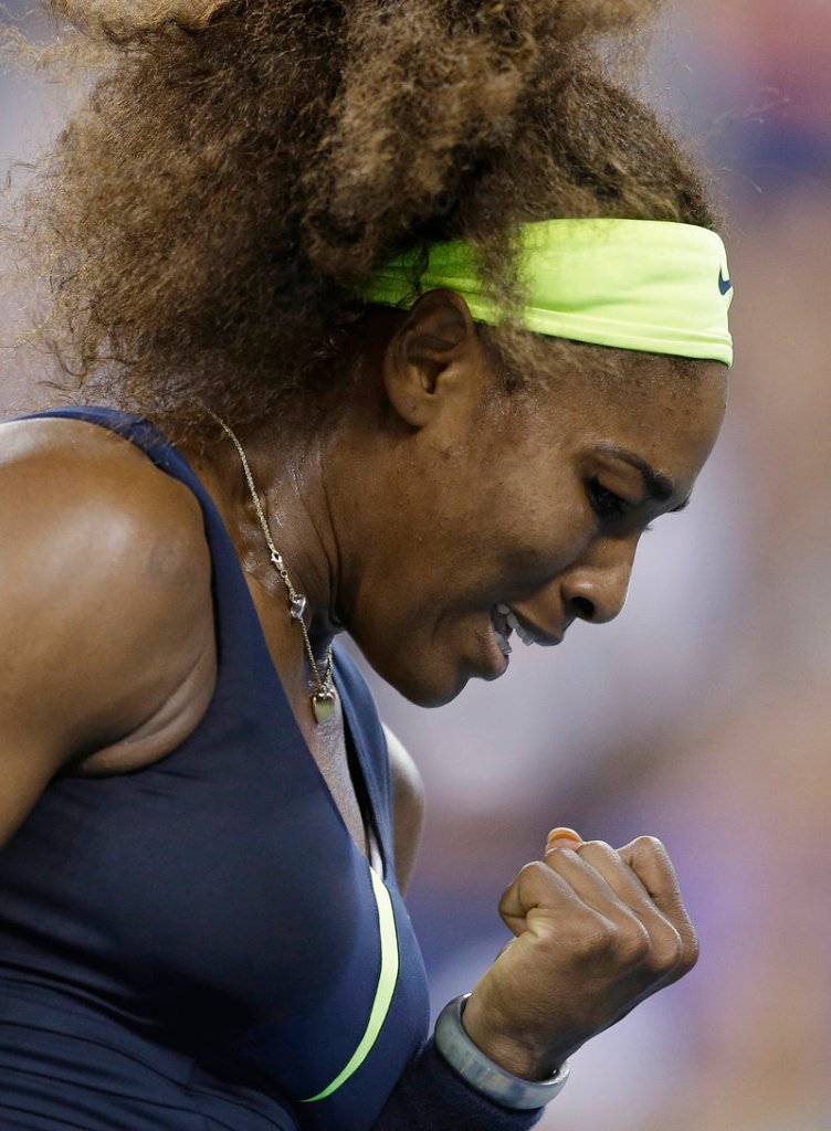 Serena Williams clenches her fist during a quarterfinal win over Ana Ivanovic at the U.S. Open on Wednesday in New York. Williams won 6-1, 6-3.