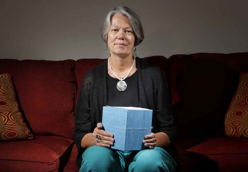 Karin Anderson of Portland holds a box containing the cremated remains of her husband, Steve Fisk, a Bowdoin College math professor who died in early 2010. She and her husband, when he was in hospice care, talked about how her to dispose of his body.