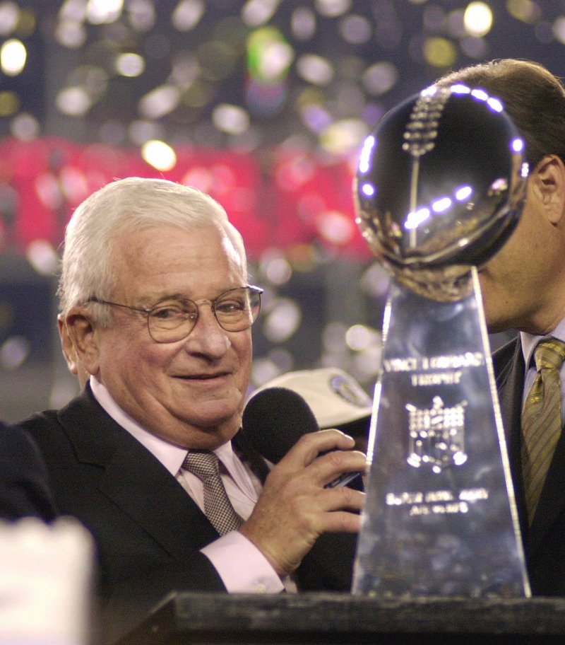 Art Modell celebrates with the Vince Lombardi Trophy on Jan. 28, 2001, after his team, the Baltimore Ravens, beat the New York Giants 34-7 in the Super Bowl at Tampa, Fla.