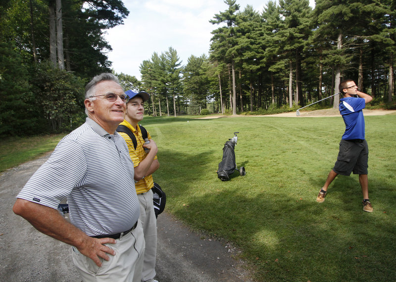 Bryce Roberts, a longtime golf pro and the new coach at Old Orchard Beach, watches one of his first-year players, Anthony Langella, practice at Dunegrass Golf Club.