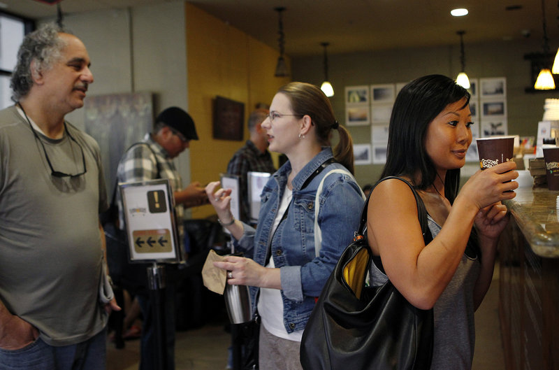 Joann Truong, right, picks up her Philharmonic coffee at Philz Coffee in San Jose, Calif. Philz is part of the so-called Third Wave in the coffee industry.