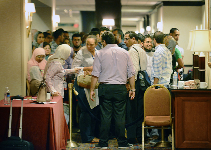 Muslims line up for the recent speed-dating session at the annual Washington convention of the Islamic Society of North America, where one speed-dater said her favorite question was, “What is your favorite vegetable?”