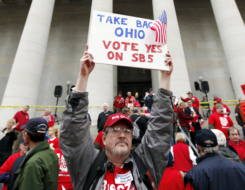 White, working class voters, particularly those from the Midwest, are becoming increasingly important to both President Obama and former Massachusetts Gov. Mitt Romney. Here, Richard Ringo, a member of a coalition of over 60 tea party groups across Ohio, demonstrates at the Ohio Statehouse in February.
