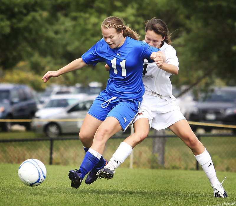 Katie Labbay of Mt. Ararat attempts to control the ball and hold off Rachel Moroney of Brunswick during their Eastern Class A girls’ soccer game Saturday. Brunswick improved its record to 3-0 with a 4-0 victory at home.