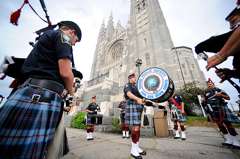 Members of the Maine Public Safety Pipe and Drum Corps play Sunday outside the Basilica of Saints Peter and Paul in Lewiston before the start of the Blue Mass. The annual Blue Mass pays tribute and offers blessings to Maine’s law enforcement, fire and emergency medical personnel and is held in September to remember those who lost their lives on Sept. 11, 2001. It was organized by Maine’s Roman Catholic Diocese.