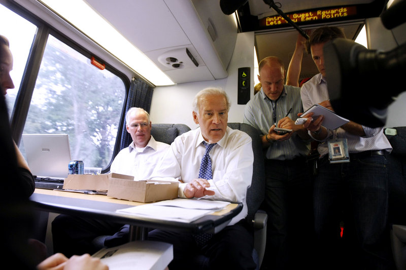 Then-Democratic vice-presidential candidate Joe Biden mingles with passengers aboard the Amtrak Acela train from Washington to Wilmington, Del. A train supporter, he has traveled the route more than 7,900 times, he said.