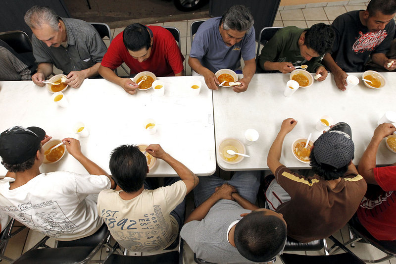 Dozens of men, many of them Mexican citizens, eat dinner at an immigrant shelter in Nogales, Mexico, last month. Some of them would decide to try to illegally cross the border into the United States. The United States no longer flies them back if they’re caught.