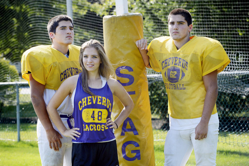 Jim Peabody-Harrington, left, and his brother, Dan, have made an impression at Cheverus, both playing on a line that has sprung holes for a team seeking a third consecutive state title. Their sister, Laura, completes the triplets, and plays field hockey and lacrosse.