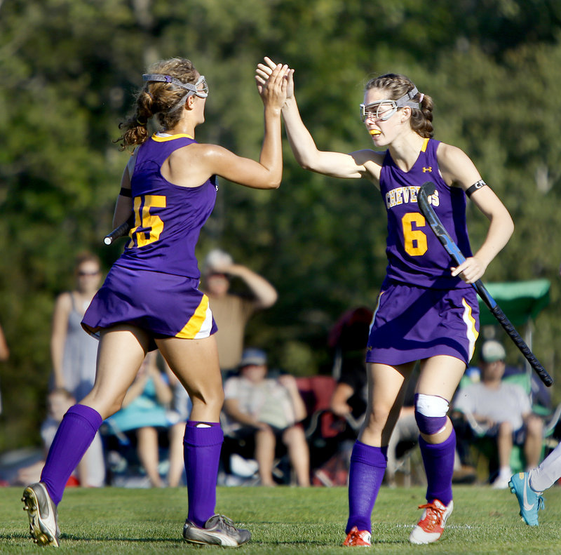 Elyse Caiazzo, left, of Cheverus high-fives teammate Meredith Willard after scoring the second goal of the first half Thursday, helping the Stags reach 6-0 with a 3-1 victory against previously undefeated Massabesic.