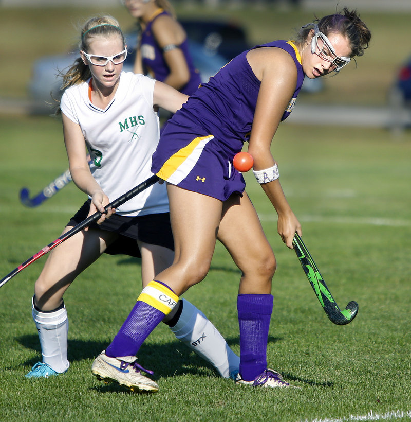 Emily Rodrigue of Cheverus looks for the ball to settle before unleashing a shot Thursday while defended by Abigail Staples of Massabesic. Cheverus won, 3-1.